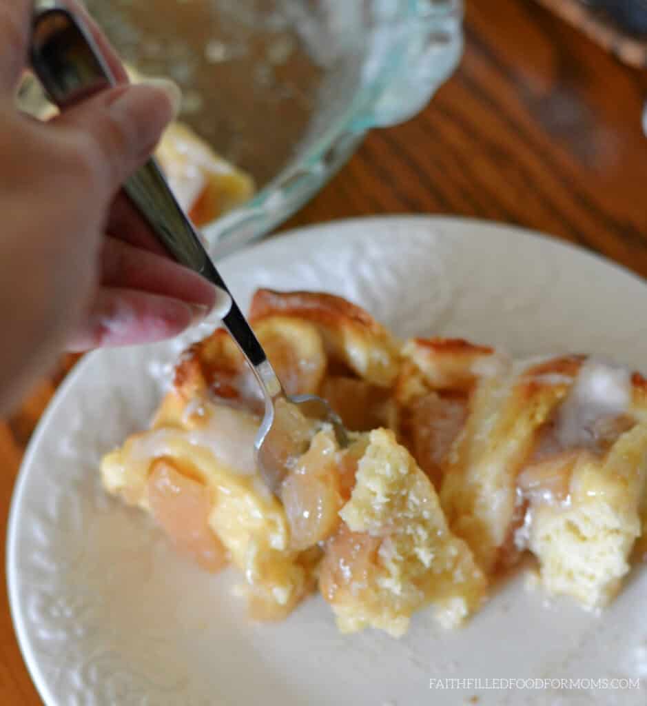 Apple Sweet Rolls with Canned Apple Pie Filling No-knead dough for homemade apple cinnamon rolls. fork, rolls and white plate.