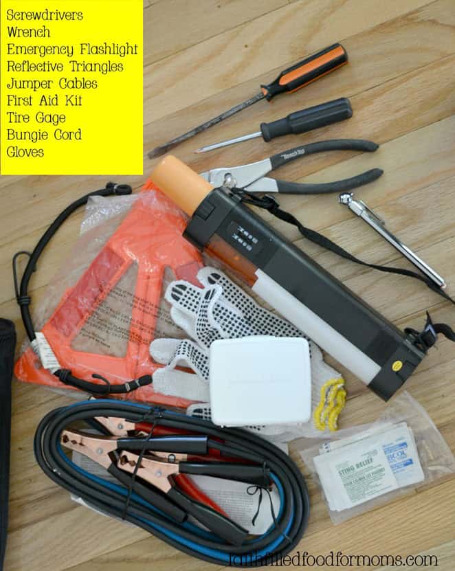 Emergency roadside kit for college students picture of an emergency roadside kit. Screwdrivers, jumper cables, wrench, tire gauge, flashlight