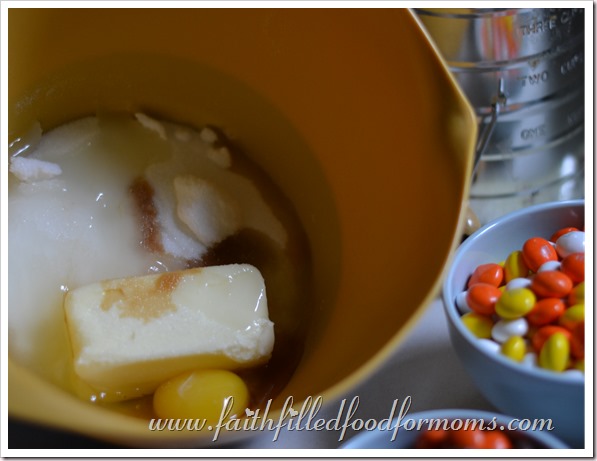 Fall Cookie Decorating Butter, sugar and eggs in a yellow bowl with M & M's beside them.