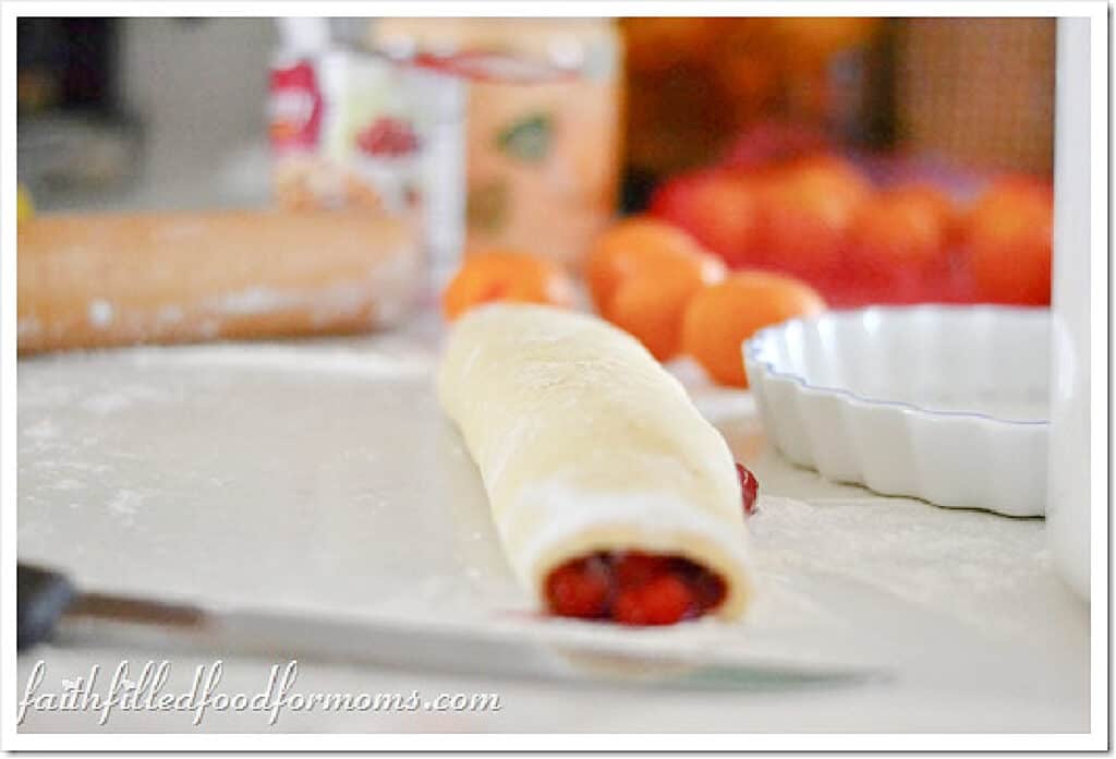 Cherry Sweet Rolls with Icing Dough rolled up with cherry filling inside