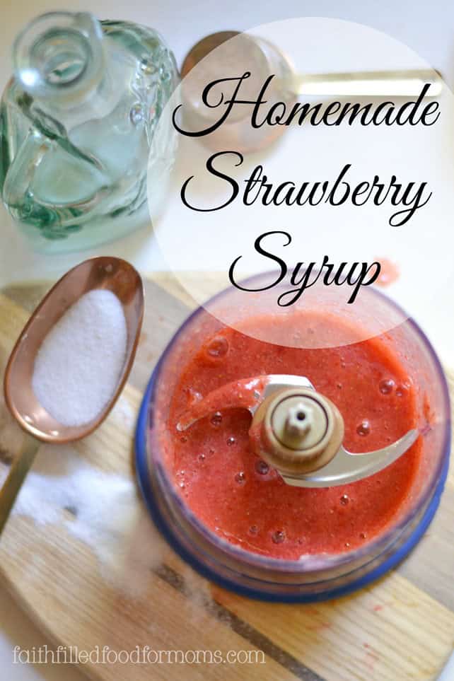 homemade strawberry syrup recipe over top view of freshly blended in a ninja blender with Strawberries for Strawberry Syrup