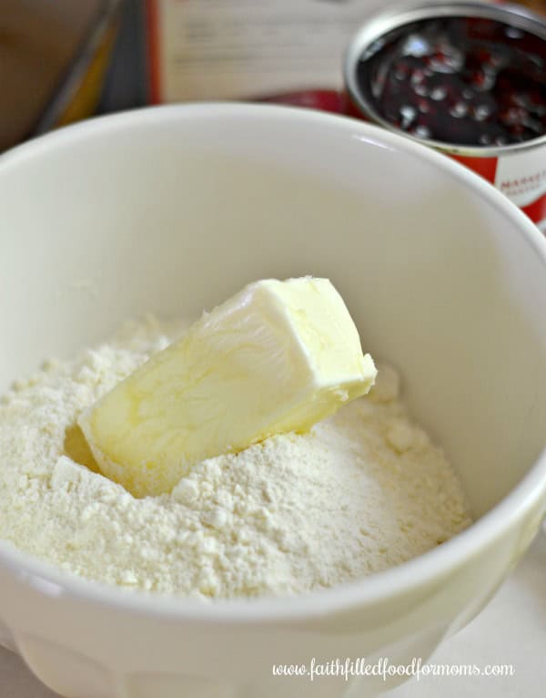 Lemon Raspberry Crumble Bars recipe butter in a bowl with cake mix