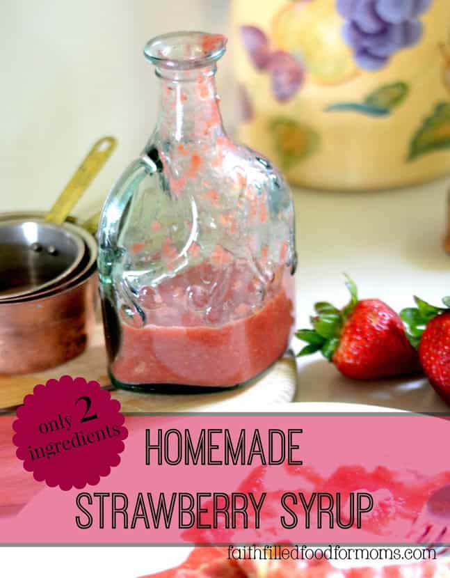 Strawberry Syrup in a pretty green clear decanter with strawberries next to it.
