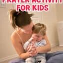 Mom teaching their child how to pray with prayer cube activity