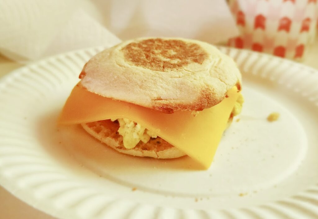 scrambled egg breakfast sandwiches One individual freezer breakfast sandwich on a plate. Not yet cooked