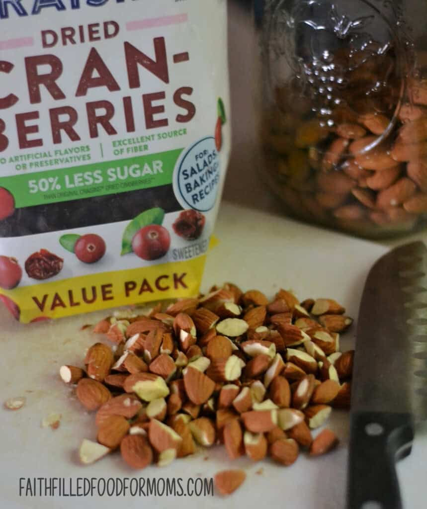 Easy Homemade Simple Granola Recipe chopped almonds and dried cranberries in a bag