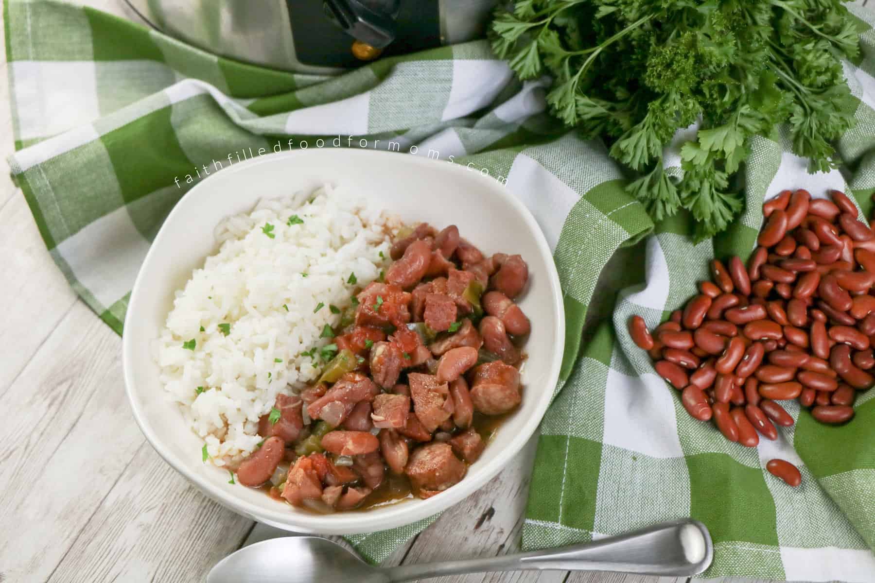 kielbasa soup slow cooker Bowl of Kiebasa soup with white rice on green and white plaid cloth