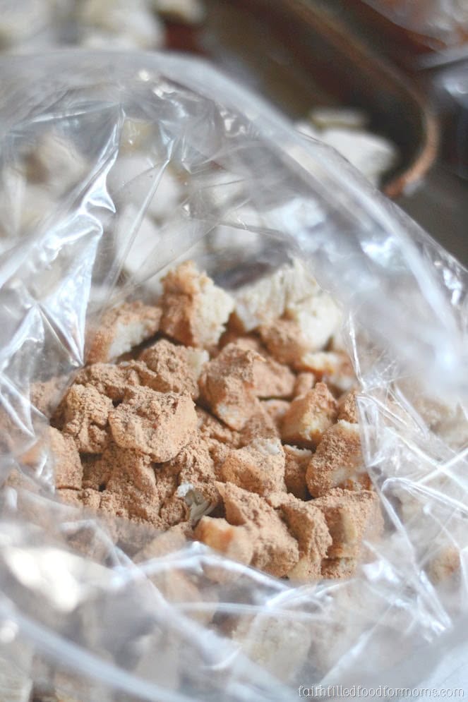 Easy Meal Prep Chicken Breast Recipes for the Freezer cooked cut up chicken in a plastic freezer bag with taco seasoning on it