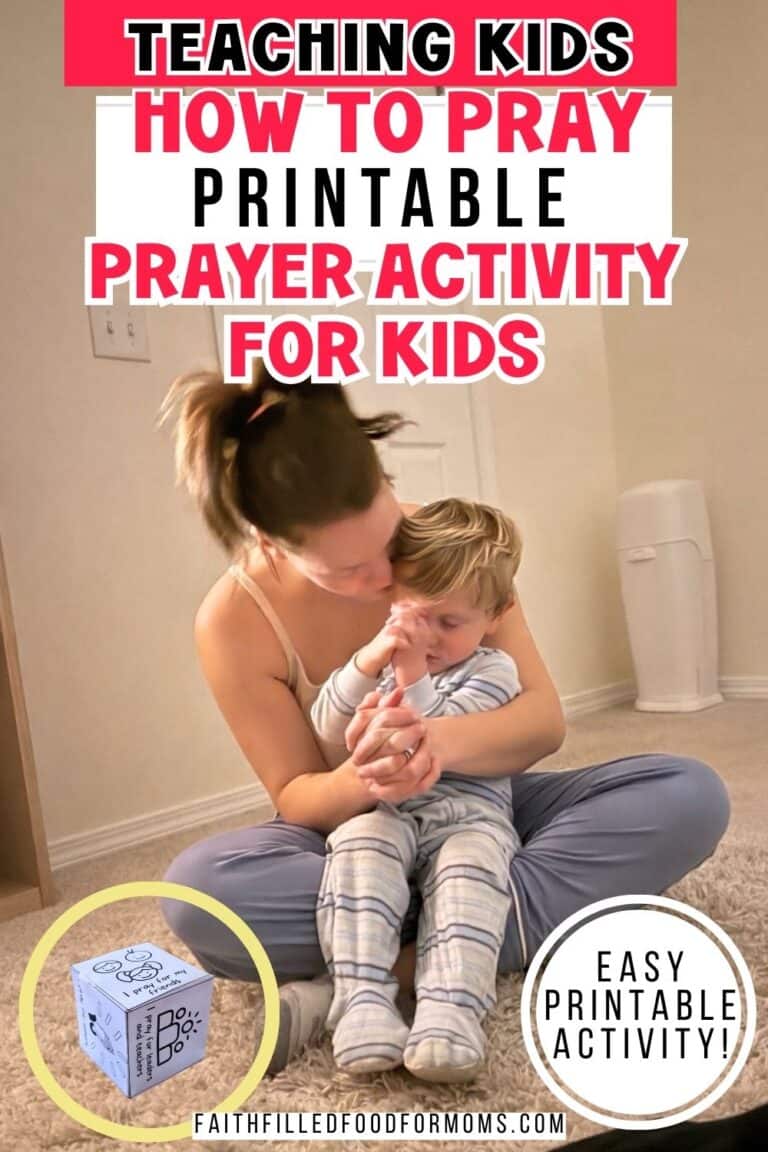 Mom is teaching a child how to pray with a prayer cube activity. Mother and small child sitting in her lap, hands folded and praying together